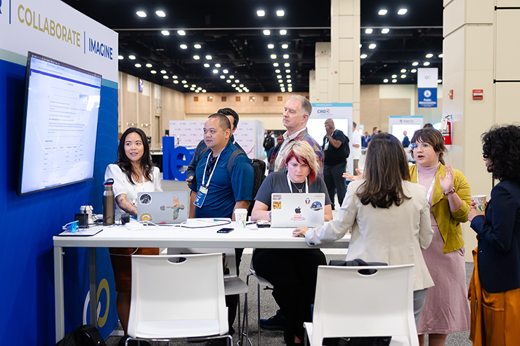 Attendees watching presentation